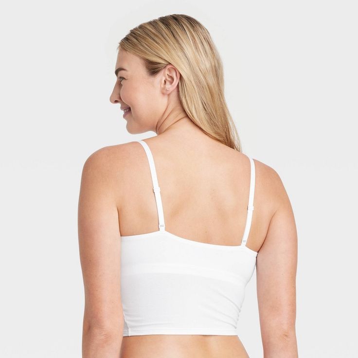 Give your everyday intimates a comfy upgrade with this Cotton Stretch Crop Cami Bralette from Auden™. This crop cami bralette is made of cotton jersey fabric with added spandex for a flexible fit that moves with you, while opaque lining provides extra coverage. The adjustable straps help you find the right fit, and unlined, wireless cups round out the design for support that maintains a natural, comfortable shape. Plus, removable padding provides a customized coverage. Auden™: Comfort true to ev Solid Color Camisole Bra For Loungewear, Seamless Camisole Bra For Loungewear, Seamless Loungewear Bra With Spaghetti Straps, Loungewear Bra With Adjustable Spaghetti Straps, Seamless Spaghetti Strap Bra For Loungewear, Medium Support Camisole With Built-in Bra, Bra Friendly Cami Crop Top For Loungewear, Fitted Cropped Bra For Loungewear, Cropped Fitted Bra For Loungewear