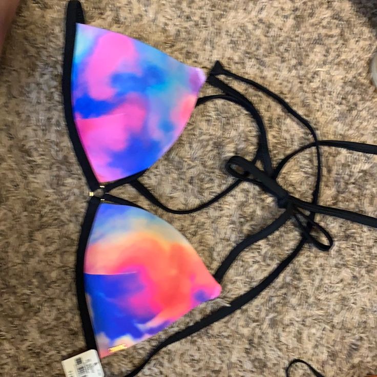 Pink Swimsuit Bikini Top In Multi / Tie Dyed Print With Black Piping. New With Tags, Size Small. Comes From Smoke Free Home. Tie Dye Swimwear For Sunbathing, Fitted Tie Dye Swimwear For Vacation, Tie Dye Beachwear Swimwear For Sunbathing, Spring Tie Dye Swimwear For Poolside, Fitted Tie Dye Swimwear For The Beach, Tie Dye Triangle Top Swimwear For Summer, Tie Dye Triangle Top Swimwear For Swimming, Summer Tie Dye Triangle Top Swimwear, Tie Dye Triangle Top Swimwear