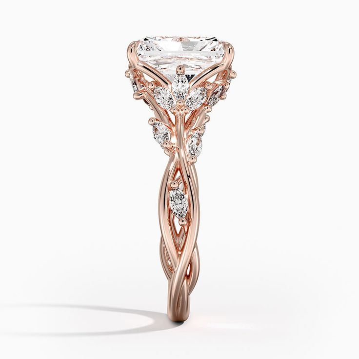 a rose gold engagement ring with an intricate design