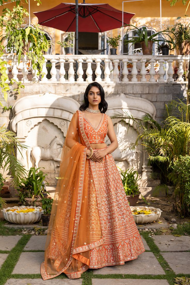 Floral Thread Embroidered Lehenga Set in Mint Green – a mesmerizing ensemble that is sure to take your breath away!
Crafted from the finest georgette fabric, this set features intricate floral thread and pearl embroidery that exudes elegance and sophistication. The refreshing mint green hue adds a touch of serenity and tranquility to the entire outfit, making it perfect for any occasion.
The lehenga comes with a matching blouse that features a classic round neckline and short sleeves, both of wh Georgette Lehenga For Eid Reception, Designer Georgette Lehenga With Resham Embroidery, Designer Georgette Lehenga For Eid, Unstitched Georgette Lehenga For Reception, Navratri Sets With Intricate Embroidery In Georgette, Unstitched Resham Embroidered Georgette Lehenga, Navratri Sets In Georgette With Intricate Embroidery, Reception Choli With Resham Embroidery In Georgette, Resham Embroidered Georgette Choli For Reception