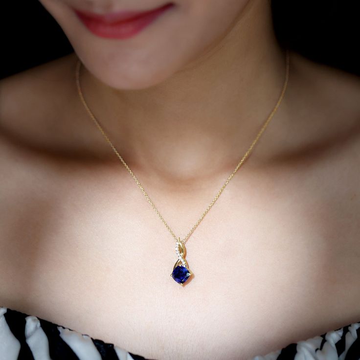 Product Details Create a memorable moment with this Lovely Infinity Pendant, designed to captivate the heart of any woman. Made with Gold Metal, this Cushion Infinity Necklace features a stunning Cushion Cut Created Blue Sapphire in a Prong Setting, adorned with Round Brilliant Moissanite in a Pave Setting. This beautifully crafted Created Blue Sapphire Pendant Necklace makes an excellent choice for the special lady in your life, sure to make her heart melt with joy. Product Information SKU SHP- Elegant Sapphire Necklaces For Valentine's Day, Elegant Blue Jewelry For Valentine's Day, Sapphire Jewelry For Valentine's Day, Blue Elegant Necklace For Mother's Day, Elegant Blue Necklaces For Mother's Day, Elegant Blue Jewelry For Mother's Day, Sapphire Necklace Pendants, Blue Sapphire Pendant, Infinity Pendant