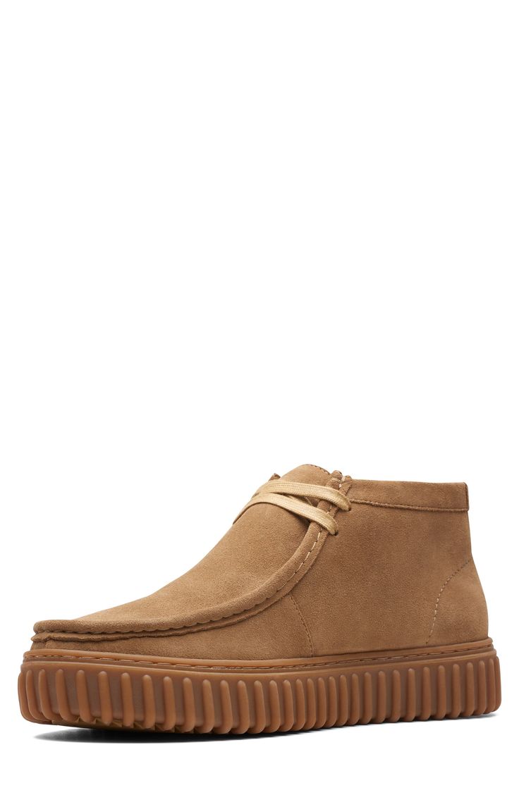 A rib-debossed bumper sole adds rugged detail to a supple suede boot that takes after the iconic Wallabee style with heritage details like skilful topstitching. Removable, cushioned insole with arch support Leather upper and lining/rubber sole Imported Classic Low-top Suede Chukka Boots, Classic Low-top Boots With Textured Sole, Rugged Suede Moc Toe Boots, Rugged Suede Boots With Moc Toe, High-top Suede Walking Boots, High-top Suede Boots For Walking, Casual Desert Boots With Vibram Sole For Walking, Classic Outdoor Boots With Textured Sole, Suede Low-top Chukka Boots With Textured Sole