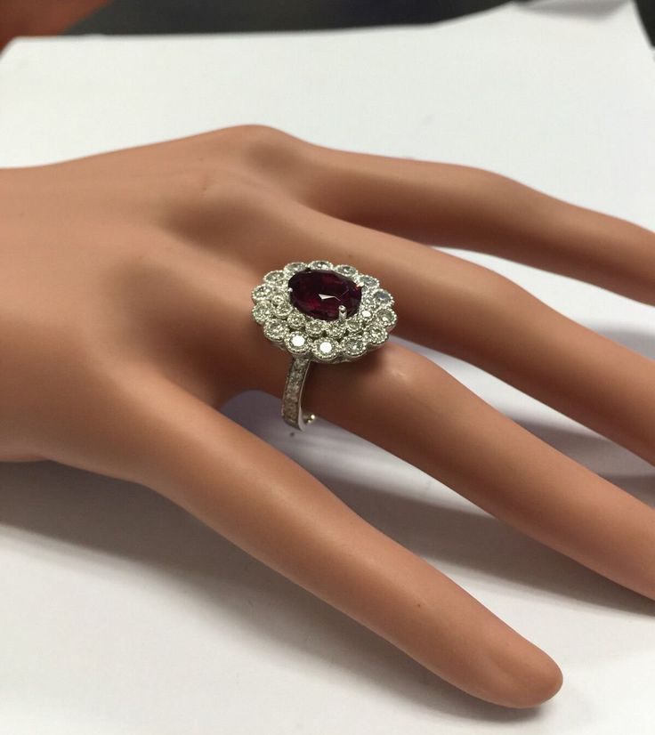 4.25 Carats Natural Very Nice Looking Tourmaline and Diamond 14K Solid White Gold Ring Suggested Replacement Value: $8,300.00 Total Natural Oval Cut Tourmaline Weight is: 2.50 Carats Natural Round Diamonds Weight: 1.75 Carats (color G-H / Clarity SI1-SI2) Ring total weight: 7.5 grams Disclaimer: all weights, measurements and colors are approximate and may vary slightly from the listed dimensions or as seen in the image. All pictures are magnified to show the smallest of details. Please, refer to Platinum Ruby Ring With 17 Jewels, Formal Multi-stone Gemstones, Luxury Ruby Cluster Ring With Center Stone, Luxury Cluster Ruby Ring With Center Stone, Fine Jewelry Tourmaline With Brilliant Cut, Formal Ruby Gemstones, Luxury Tourmaline Jewelry With Halo Setting, Brilliant Cut Round Tourmaline Jewelry, Round Brilliant Cut Tourmaline Jewelry