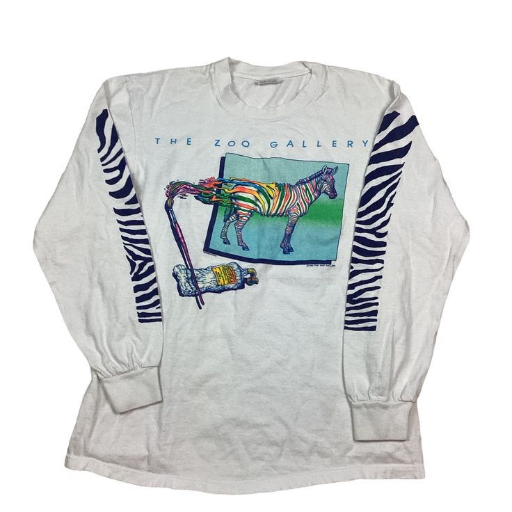 Vintage 1983 The Zoo Gallery Long Sleeve Stand Out From The Herd Zebra single, stitch T-shirt. Made in the USA. Double sided graphic. Measures as an XS/XXS. 17 inches pit to pit, 24 inches long. Excellent vintage condition. Smoke and pet free home. 80s single stitch T-shirt. USA made. 90s Long Sleeve Graphic T-shirt, 90s Graphic Print Long Sleeve T-shirt, Vintage Long-sleeve Graphic Print T-shirt, 90s Long Sleeve Pre-shrunk Tops, 90s Style Long Sleeve Pre-shrunk Top, Vintage Long Sleeve Tops With Graphic Design, Vintage Long Sleeve Graphic Tops, 90s Style White Tops With Vintage Print, Couture Simple