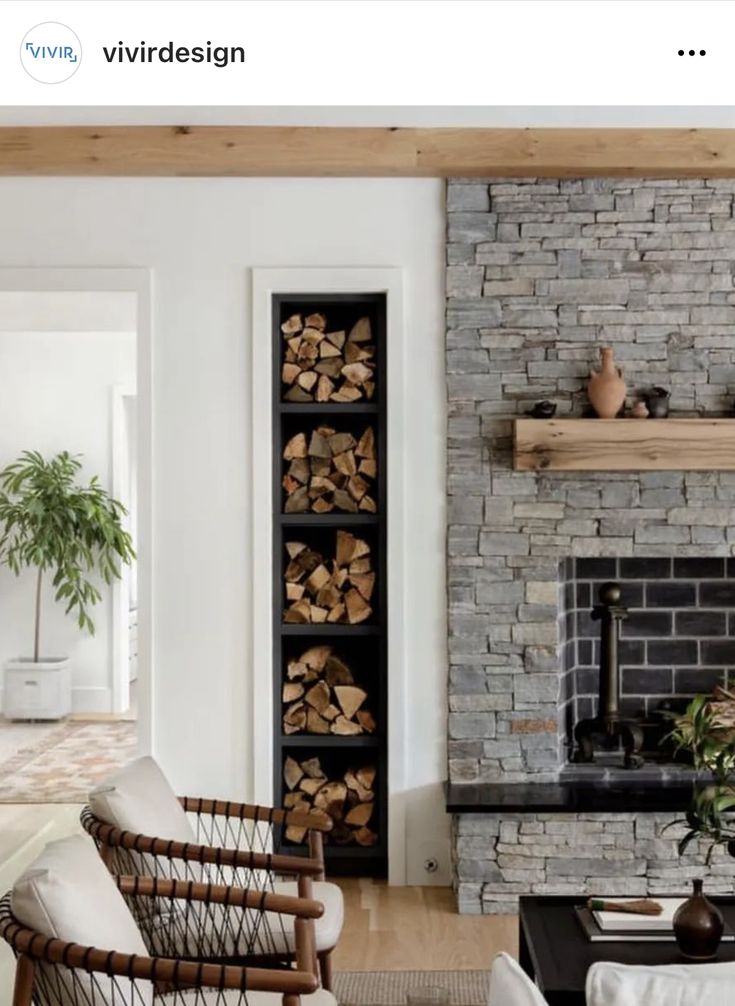 a living room filled with furniture and a fire place in front of a brick wall