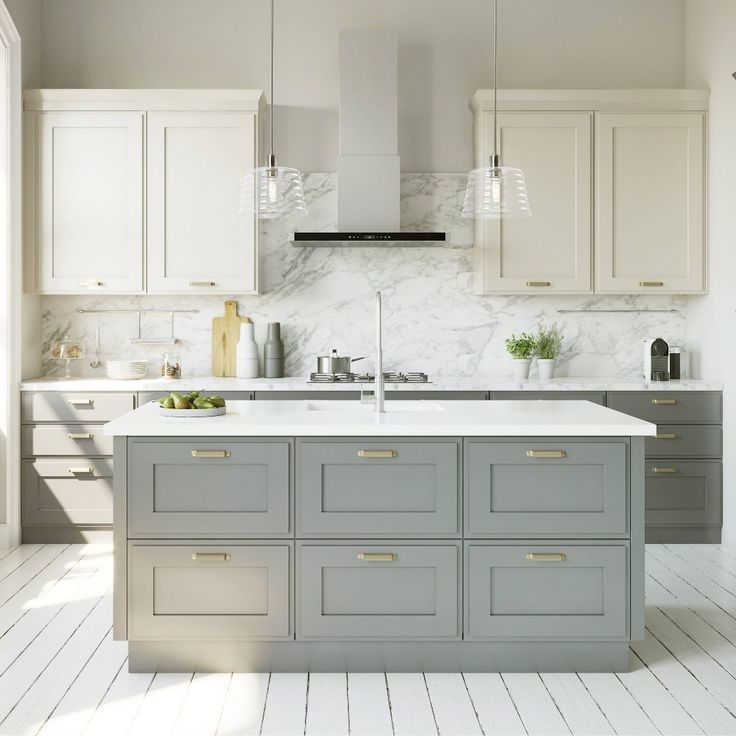 a kitchen with marble counter tops and gray cabinets, along with white flooring that matches the walls