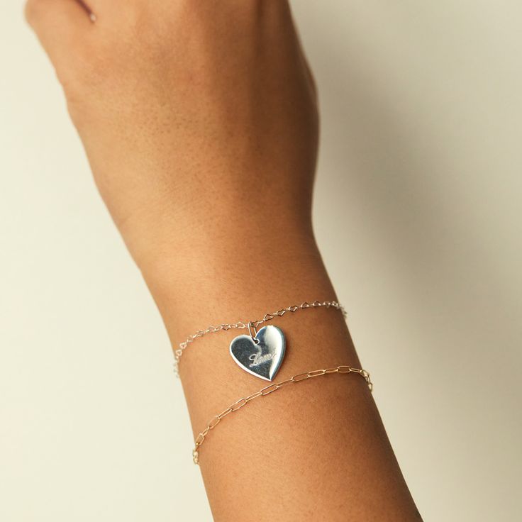 A chain made of tiny hearts, linked together one to the next. The ultimate friendship bracelet. Silver Heart Charm Bracelet For Friendship, Personalized Sterling Silver Heart Friendship Bracelet, Heart-shaped Bracelet With Heart Charm For Promise, Friendship Bracelets With Double Heart Charm, Silver Paperclip Bracelet With Delicate Chain, Silver Delicate Chain Paperclip Bracelet Gift, Delicate Chain Bracelet For Friendship, Valentine's Day Heart Charm Bracelet For Promise, Valentine's Day Promise Heart Charm Bracelet