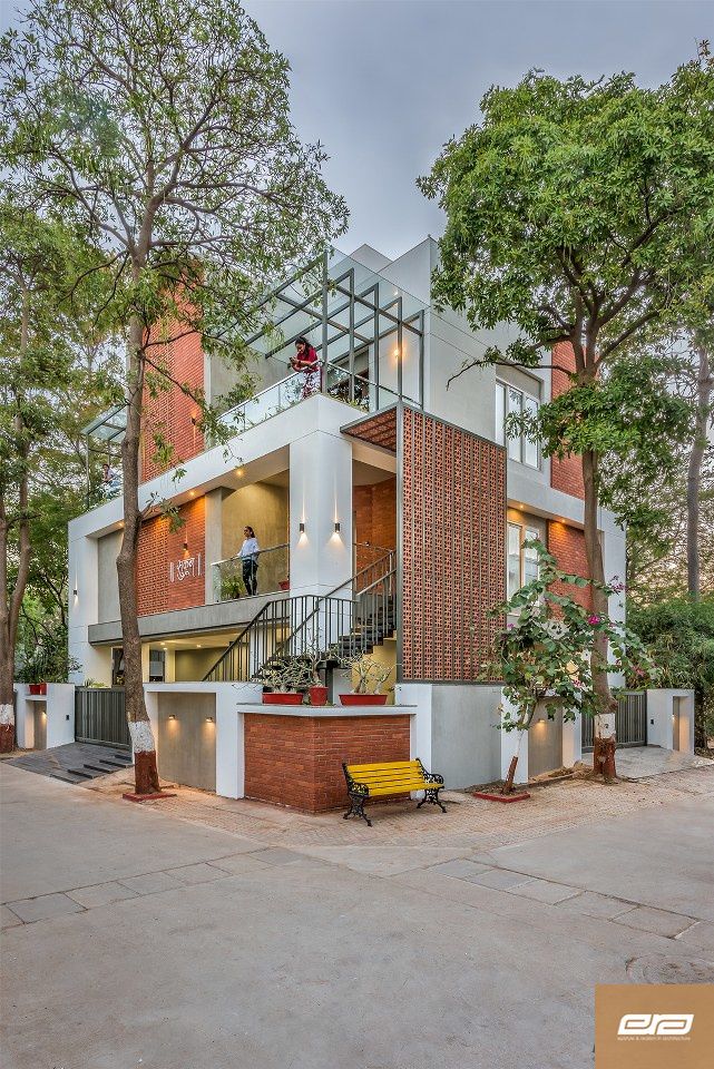 an apartment building with stairs leading up to the second floor