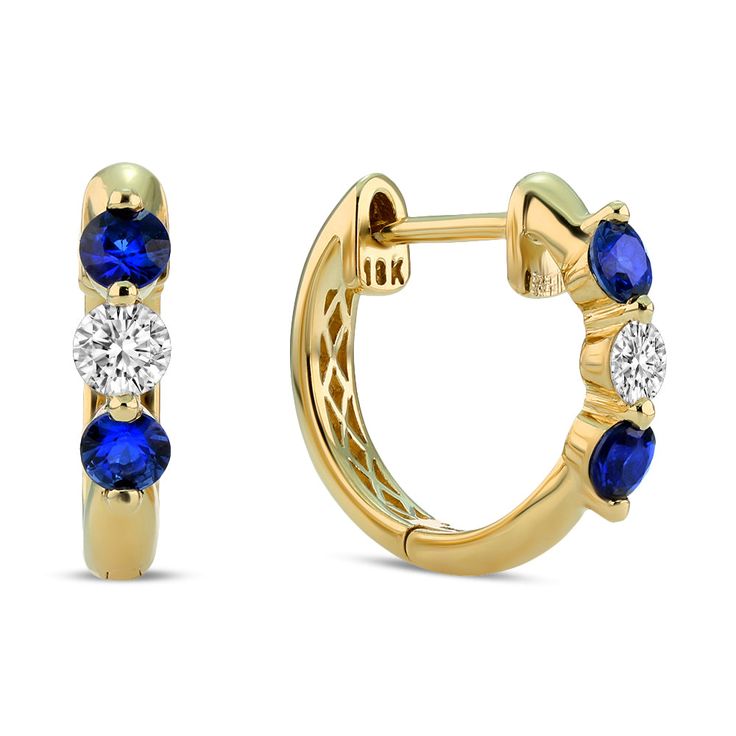 Two vibrant royal blue sapphires rest alongside a sparkling petite diamond in this minimalist and timeless style that can be worn effortlessly for a variety of occasions. Their lightweight nature makes them a comfortable essential that is suitable for styling solo or stacked with other similar huggies. Metal: 18kt Gold Sapphire Weight: 0.40 ct. Diamond Weight: 0.21 ct. Measurements: 12.5 mm drop *Please note that the listed ct. weights are approximate and may be subject to slight variations. Luxury Sapphire Diamond Earrings In Yellow Gold, Sapphire Hoop Earrings Fine Jewelry, Fine Jewelry Sapphire Diamond Earrings, Sapphire Diamond Earrings With Accents, Sapphire Round Hoop Earrings Fine Jewelry, Sapphire Diamond Accented Earrings In Fine Jewelry, Elegant Blue 14k Gold Huggie Earrings, Blue Diamond Hoop Earrings Fine Jewelry, Sapphire Diamond Earrings With Gemstone Detail