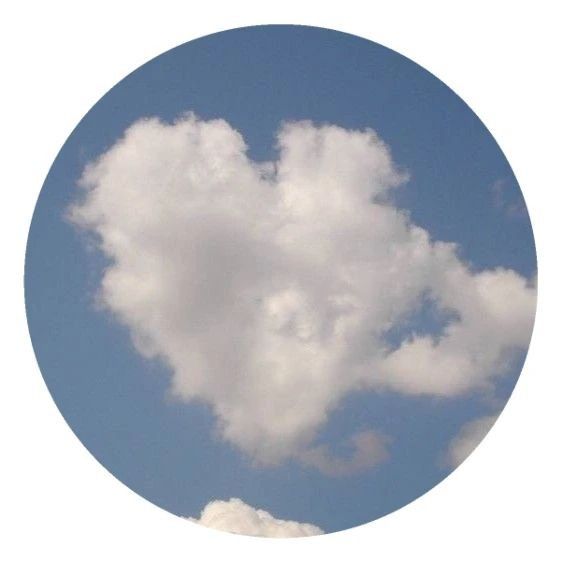 a heart shaped cloud in the blue sky