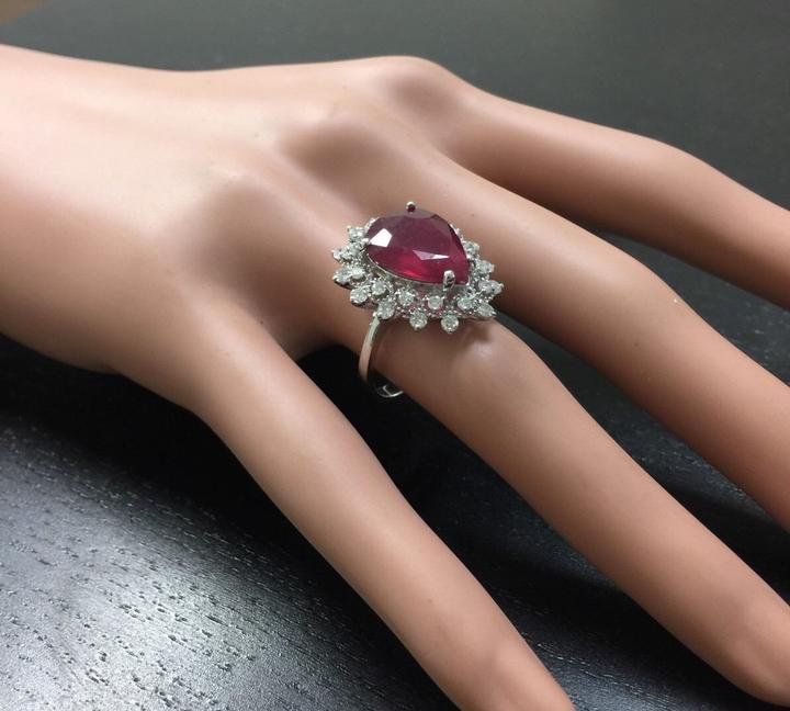 7.90 Carats Impressive Natural Red Ruby and Diamond 14K White Gold Ring Suggested Replacement Value $6,200.00 Total Natural Red Ruby Weight is: Approx. 7.00 Carats (lead glass filled) Ruby Measures: Approx. 14.20 x 10.70mm Natural Round Diamonds Weight: Approx. 0.90 Carats (color G-H / Clarity SI1-Si2) Ring total weight: Approx. 5.8 grams Disclaimer: all weights, measurements and colors are approximate and may vary slightly from the listed dimensions or as seen in the image. All pictures are mag Emerald Cut Aquamarine Ring, Lead Glass, Emerald Cut Rings, Etsy Gold Ring, Halo Setting, Red Band, Peridot Ring, 14k White Gold Ring, Red Ruby