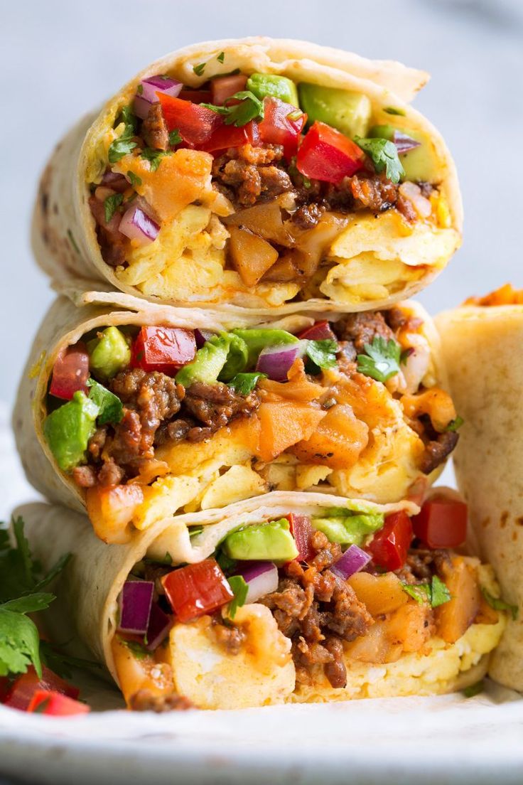 three breakfast burritos stacked on top of each other with the title overlay