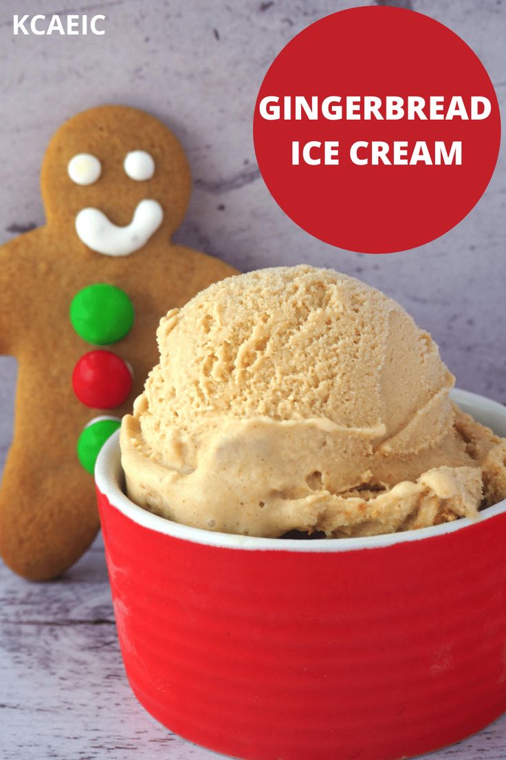 a red bowl filled with ice cream next to a gingerbread man