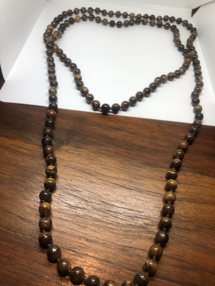 Gorgeous and delicate hand knotted Tiger's Eye long necklace All jewelry is shipped in a nice gift box. Check out our over a THOUSAND great reviews Brown Long Necklace With 108 Beads, Long Brown Necklace With 108 Beads, Brown Beaded Long Necklace For Gift, Brown Beaded Long Necklace Gift, Gift Hand-strung Brown Beaded Necklaces, Brown Hand-strung Beaded Necklace For Gift, Brown Hand-strung Beaded Necklace Gift, Gift Brown Hand-strung Beaded Necklaces, Brown Beaded Necklaces As Gifts