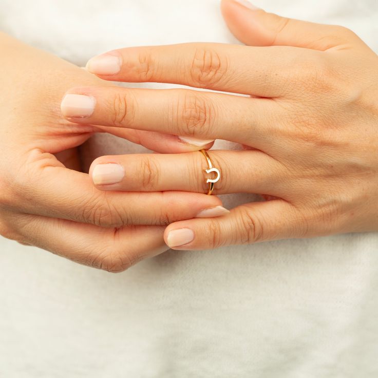 Our Handmade 14K Solid Gold Horseshoe Ring is a fusion of elegance and a timeless symbol of good luck. Exquisitely crafted from 14K solid gold, this dainty ring is an embodiment of fine craftsmanship and meaningful design. The horseshoe, measuring 6.25 mm by 5.8 mm, is perfectly proportioned to add a touch of charm to your daily attire without being overpowering. Available in a range of colors – the classic sheen of gold, the soft glow of rose gold, or the sleek allure of white gold – this ring Horseshoe Ring, Dainty Ring, Lucky Charm, Exquisite Jewelry, Charm Jewelry, Handcrafted Jewelry, Solid Gold, Rose Gold, White Gold