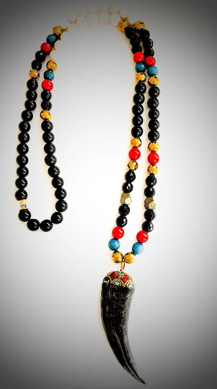 Onyx Tibetan Necklace The many properties you get out of this 14 inch necklace. Made with smooth onyx, red and white coral, turquoise, Pyrite, and gold hematite beads. Black Handmade Beaded Necklaces For Healing, Black Spiritual Beaded Necklaces With Polished Beads, Handmade Black Beaded Necklaces For Healing, Healing Onyx Beaded Necklaces With Black Beads, Black Beaded Necklaces With Colorful Beads For Spiritual Use, Black Necklaces With Gemstone Beads For Healing, Black Handmade Beaded Necklace For Healing, Black Bohemian Necklace As Gift, Black Necklace With Gemstone Beads For Healing