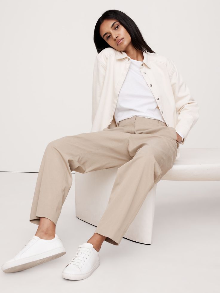 Reach for these pants when your schedule calls for all-day comfort—we kept the silhouette casual, adding a concealed elastic waistband at back for a custom fit.  Here, we cut this pant in a luxuriously soft, buttery feeling blend of TENCEL™ lyocell and organic cotton.  Relaxed Tapered fit: High rise (11") with a relaxed fit through the thigh and tapered leg.  Ankle length.  Sustainability: Made with certified organic cotton and TENCEL™ lyocell, a sustainably sourced fiber from responsibly-harves Relaxed Fit High-waisted Wide Leg Pants For Business Casual, High-waisted Wide Leg Pants For Business Casual, Effortless Relaxed Fit Straight Leg Pants, Effortless Pants With Loosely Fitted Hips And Tapered Leg, Relaxed Fit High-waisted Chinos For Everyday, Versatile Relaxed Fit Chinos For Work, Relaxed Straight Leg Work Pants, Spring Versatile Relaxed Fit Dress Pants, Effortless Workwear Bottoms With Elastic Waistband