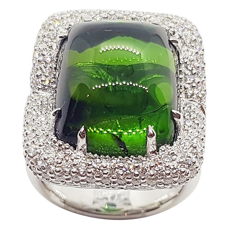 Cabochon Green Tourmaline 30.45 carats with Diamond 1.92 carats Ring set in 18 Karat White Gold Settings Width: 2.2 cm Length: 2.5 cm Ring Size: 54 Total Weight: 22.78 grams "We first opened doors in 1980 when it was then situated in the vicinity of the Victory Monument; a small and modest storefront with a couple of counters. From its humble beginnings to where it stands today, our company has proven its abilities as a jeweler. Since the beginning, we have been supplying fine quality pieces to Green Ring, Green Rings, Humble Beginnings, Diamond Ring Settings, Green Tourmaline, Dream Jewelry, Jewelry Designs, Diamond White, Ring Set