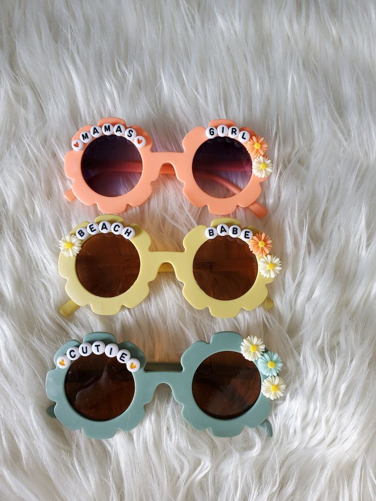 How adorable are these sunnies!? Perfect for the summer sun! These custom sunglasses make the perfect gift or grab a pair for your little one! Each pair is handmade. Approx 5in wide across front of glasses Cute Customizable Plastic Sunglasses, Customizable Cute Summer Sunglasses, Customizable Fun Plastic Sunglasses, Fun Handmade Sunglasses As A Gift, Personalized Plastic Sunglasses For Summer, Playful Customizable Adjustable Sunglasses, Fun Sunglasses With Gradient Lenses For Gift, Cute Customizable Sunglasses For Beach, Custom Name Sunglasses As Summer Gift