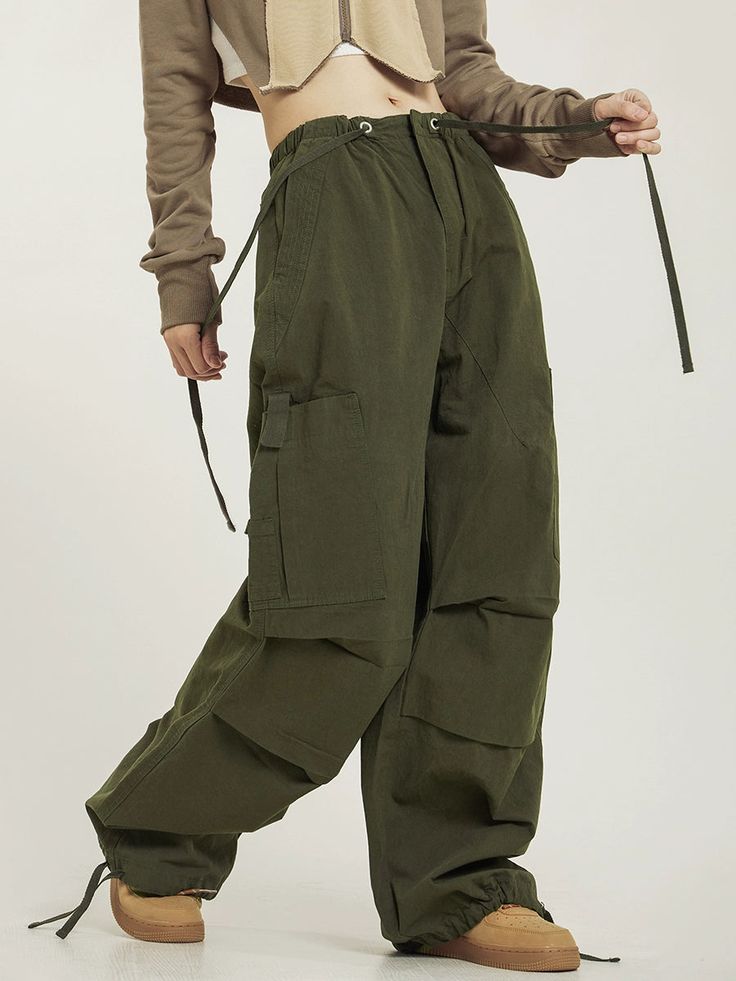 CTB relaxed-fit cotton blend cargo pants, drawstring at hem and elasticized waistband, flap-close pockets at outseams, four-pocket styling. Composition - Cotton Blend Sizing: US/EU Regular Fit Model: 168cm/55kg 5'6/121lbs wearing size M Cotton Combat Cargo Bottoms, Cotton Cargo Combat Bottoms, Relaxed Fit Cotton Combat Parachute Pants, Utility Cotton Parachute Pants Full Length, Combat Style Cotton Bottoms With Pockets, Cotton Combat Bottoms With Multiple Pockets, Combat Cotton Bottoms With Multiple Pockets, Combat Cotton Parachute Pants With Multiple Pockets, Baggy Cotton Cargo Pants For Spring