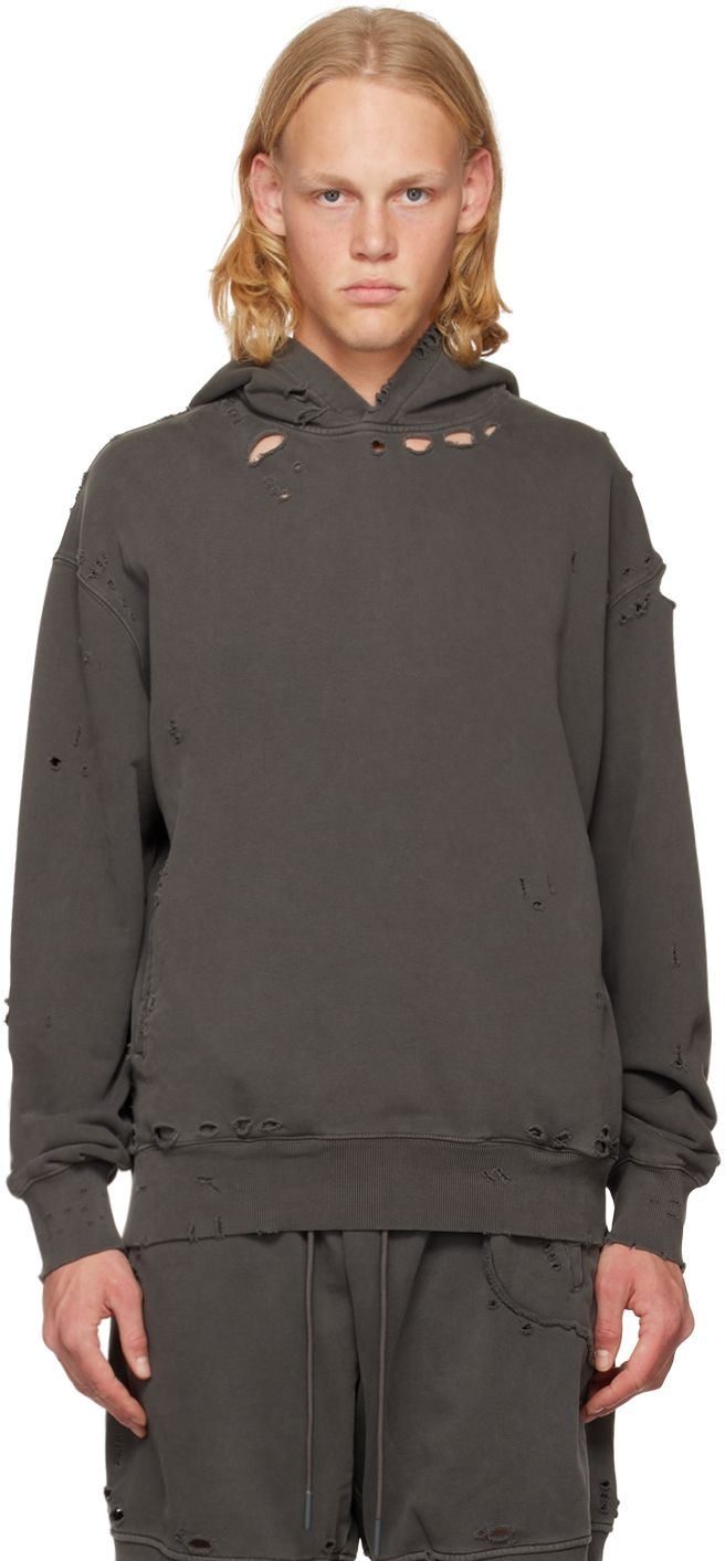 Garment-dyed French terry hoodie. Embroidered cut-outs and distressing throughout. · Welt pockets · Rib knit hem and cuffs · Dropped shoulders · Hinged O-ring at interior hem Each item is unique. Please note that coloration may vary. Supplier color: Slate gray Oversized Distressed Winter Sweatshirt, Oversized Distressed Sweatshirt For Winter, Distressed Washed Black Hoodie For Fall, Distressed Washed Black Hoodie, Distressed Washed Black Hoodie Relaxed Fit, Washed Black Distressed Hoodie Relaxed Fit, Distressed Washed Black Hoodie In Relaxed Fit, Distressed Cotton Sweatshirt In Washed Black, Hooded Distressed Washed Black Sweatshirt