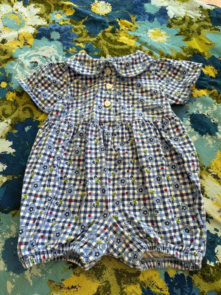 Cute vintage 90s Baby B'Gosh blue bubble romper. Tagged size 6-9 months. Good condition with light wear, please see the pictures. Thanks for looking! Playful Gingham Bubble Romper For Spring, Casual Blue Short Sleeve Bubble Romper, Plaid Cotton Bubble Romper For Summer, Summer Plaid Cotton Bubble Romper, Summer Cotton Plaid Bubble Romper, Cute Gingham Bubble Romper For Spring, Blue Short Sleeve Onesie For Spring, Spring Gingham Bubble Romper For Playtime, Cute Summer Plaid Bubble Romper