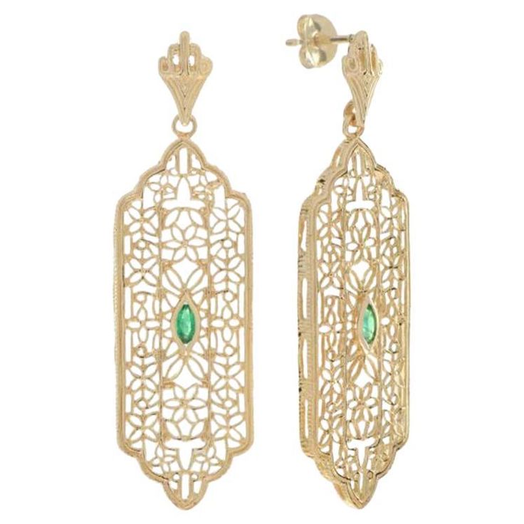 Add a delicate and unique aesthetic to your look with these filigree earrings by GEMMA FILIGREE. Our antique design gold filigree earrings equate to delicacy and light openwork, while maintains strength for everyday wear for a lifetime. This striking filigree design earrings with floral and leaf motif is a symbol of growth and femininity, encompassing a beautiful meaning for the wearer. CHARACTERISTICS Status: Made to order Origin: Thailand Metal: Solid 9K Yellow Gold Earrings Size: 13 mm. x 45 mm. Total Gemstones Weight: 0.15 Carat (approx.) Total Gram Weight: 5.27 g. (approx.) *Pictures have been enlarged to show details* PRIMARY STONE(S) Stone: Natural Emerald Color: Green Shape: Marquise Size: 4x2 mm. Number: 2 Weight: 0.15 Carat (approx.) All of our jewelry are always made of gold or Gold Filigree Earrings, Beautiful Meaning, Custom Jewelry Box, Yellow Gold Earrings, Leaf Motif, Emerald Color, Filigree Earrings, Filigree Design, Design Earrings