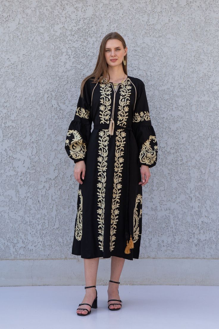 **Note : The kaftan in the video is a different color of the exact same Kaftan and is only displayed to show the fit, flow, and cut of the Kaftan. You will receive the one in the pictures.** Feel like a bohemian queen in this eccentric and beautiful embroidered tunic dress. The dress is made of Linen and Egyptian cotton which is widely renowned for its quality and texture. The dress is light and extremely soft and can be used on many occasions - beach, lounge, or even in your home to feel comfor Festival Tunic Dress With Embroidered Border, Folk Style Tunic Dress For Eid, Festive Tunic Kaftan With Floral Embroidery, Summer Bohemian Kurta With Embroidered Sleeves, Long Cotton Dresses For Eid, Bohemian Summer Kurta With Embroidered Sleeves, Long Sleeve Dress With Embroidered Border For Festivals, Festive Cotton Dress With Embroidered Sleeves, Elegant Spring Kaftan With Embroidered Sleeves