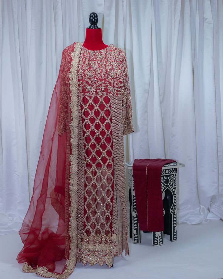 It has an all-machine embroidered base with gold tilla and has hand embellishment work on it on the front and sleeves. It is closed from the sides and has front slits. It is paired with an organza dupatta which is stitched with a gold border on all four sides. 4 pieces. Unstitched Hand Embellished Chinon Salwar Kameez, Festive Semi-stitched Hand Embellished Kurta, Semi-stitched Hand Embellished Kurta For Diwali, Festive Semi-stitched Hand Embellished Salwar Kameez, Bollywood Style Semi-stitched Hand Embellished Kurta, Festive Hand Embellished Semi-stitched Kurta, Festive Unstitched Hand Embellished Salwar Kameez, Festive Hand Embellished Semi-stitched Salwar Kameez, Bollywood Style Hand Embellished Straight Salwar Kameez