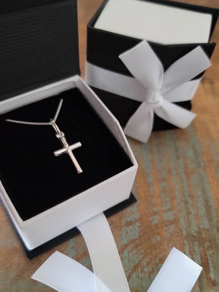 Small, Genuine .925 Italian Sterling Silver Cross Necklace. Sterling Silver small Cross Pendant measures 1 inch (with bail) Sterling Silver .08mm Cable or Box Chain, choose style & length at checkout Arrives in a Beautiful Necklace Gift Box See More Of My Shop Here: http://www.etsy.com/shop/ForeverMemoryDesigns Silver Cross Jewelry, Mens Chain Bracelet, Necklace Gift Box, Sterling Silver Cross Necklace, Simple Cross, Drop Pendant Necklace, Cross Jewelry, Sterling Silver Cross, Cross Charms