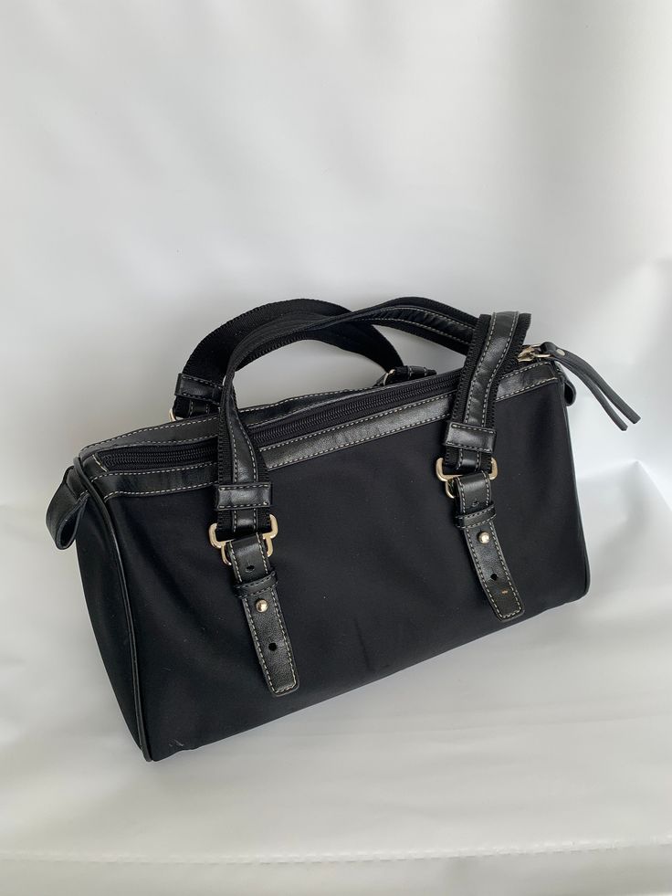 "PEGASO SHOULDER BAG Black canvas/leather women's bag Vintage purse Gift for women Gift for her Good t condition. Very clean, no stains inside, no any odors. There is a scratch on the front side covered by a strap.Very comfortable and lightweight bag. Measurements: 11\" X 6\" X 4\" 2 straps: 21\" Picture's colors may appear slightly different based on the monitor's setting." Purse Gift, Bag Measurements, Lightweight Bag, Vintage Purse, Leather Bag Women, Shoulder Bag Black, Genuine Leather Bags, Bag Vintage, Womens Purses