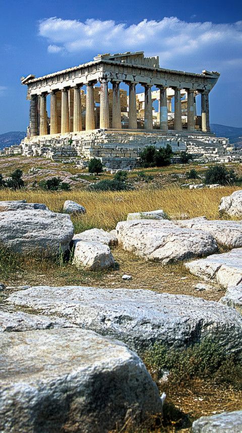 an ancient temple on top of a rocky hill