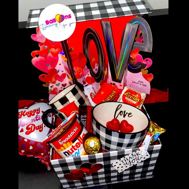 a valentine's day gift box filled with candy and candies