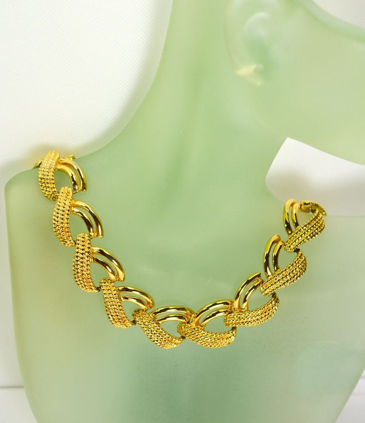 This stunning gold_plated multi chain collar necklace looks like a piece of fine Byzantine jewelry owing to the rich gold-plated metal setting.  The length of this piece of jewelry is almost 16.5" long and 5/8" wide. It weighs 2  oz. The necklace fastens with a flip over clasp.  Condition is excellent with no obvious damage or wear. This is a gorgeous marked Napier  Pat Pend  4.774.743. Vintage piece from 1980's. We combine shipping.   Thank You for visiting our Etsy https://www.etsy.com/shop/Vi Costume Jewelry Plated Necklaces For Jewelry Making, Plated Costume Jewelry Necklaces For Formal Occasions, Formal Plated Costume Jewelry Necklace, Plated Metal Costume Jewelry Necklace, Gold Chain Link Necklace For Formal Occasions, Formal Adjustable Chain Necklace, Formal Adjustable Chain Costume Necklace, Gold Plated Chain Link Jewelry, Formal Gold Plated Clavicle Chain Necklace