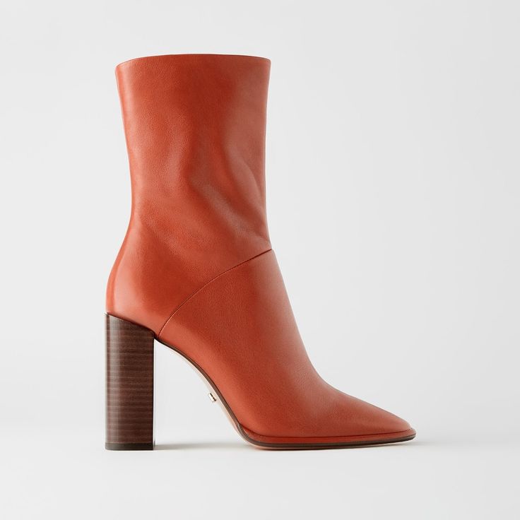 New With Tag. Upper 100% Cow Leather. Lining 69% Cotton 21% Goat Leather 10% Polyurethane. Sole 100% Rubber. Inslose 100% Goat Leather Russet Orange - 2166/510. Heeled Leather Ankle Boots In Rust. Soft Leather Upper. Lined Shaft. Wide Wood-Look Heel. Inner Side Zip Closure. Heel Height 3.6 Inches 9.1 Cm Color Russet Orange 2166/510 Faux Leather Heeled Boots With Sculpted Heel For Work, Ankle-high Boots With Reinforced Heel For Office, Office Ankle-high Boots With Reinforced Heel, Office Boots With Reinforced Heel And Ankle-high Design, Office Boots With Reinforced Heel, Ankle-high, Mid-calf High-heel Boots With Stacked Heel For Work, Mid-calf High Heel Boots With Stacked Heel For Work, Chic Ankle-high Work Boots, Calf Leather Ankle-high Heeled Boots For Office