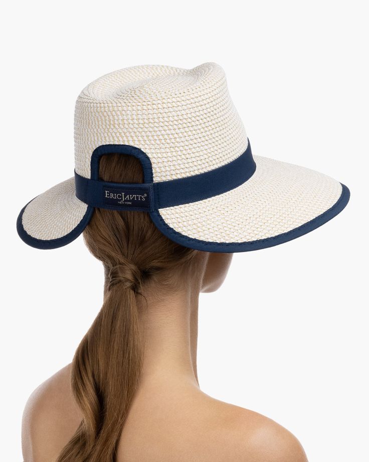 The Sun Crest visor is a stylish hybrid of the classic high-crowned fedora hat and a practical visor with a generous 4-inch brim. This fashionable Squishee® straw hat is trimmed with grosgrain ribbon for a chic, polished finish. You'll turn heads wherever you go this summer. Our revolutionary Squishee material is a synthetic straw fabric constructed from partially recycled plastics. This environmentally friendly material resembles genuine raffia straw, but it offers several practical advantages