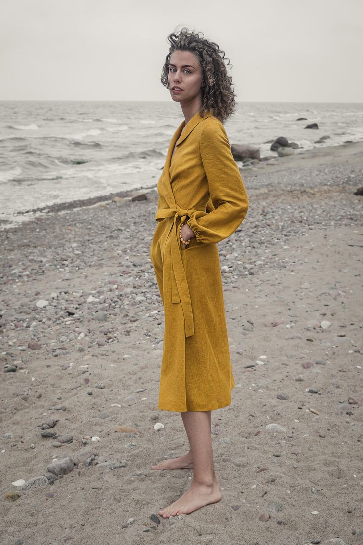 It's essential to fill your summer wardrobe with breathable, easy-to-style pieces like our natural linen dress. A relaxed take on tailoring, this midi dress is cut from breezy linen in a mustard yellow hue and has a tie belt to define your waist. Wear it with sneakers, sandals and ankle boots alike. DETAILS ♥ Handmade with attention to every detail. ♥ Tie belt ♥ Side pockets ♥ Easy and breathable linen FABRIC Available in any color from the list. We only use eco-friendly all-natural linen. Linen Solid Color Linen Dress For Daywear, Linen Dress For Daywear, Linen Midi Dress For Daywear, Chic Solid Color Linen Dress, Spring Linen Midi Dress, Chic Cotton Wrap Dress, Midi Length, Fall Midi Wrap Dress For Daywear, Fall Midi Length Wrap Dress For Daywear, Linen Solid Color Daywear Dresses