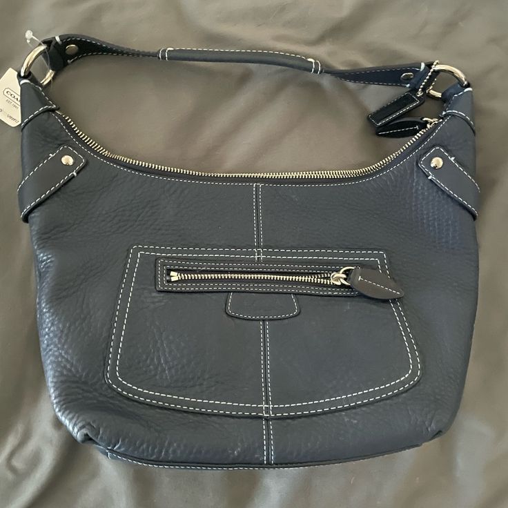 Coach Penelope Navy Blue Pebbled Leather Hobo Bag F14680 Coach Pebbled Leather Double Handle Shoulder Bag, Coach Pebbled Leather Shoulder Bag With Double Handle, Coach Soft Leather Satchel Hobo Bag, Pebbled Leather Satchel With Silver-tone Hardware, Daily Use Pebbled Leather Shoulder Bag With Silver-tone Hardware, Coach Leather Hobo Bag With Zipper Closure, Blue Leather Shoulder Bag With Zipper Closure, Coach Shoulder Bag With Textured Leather For Daily Use, Coach Textured Leather Shoulder Bag For Daily Use