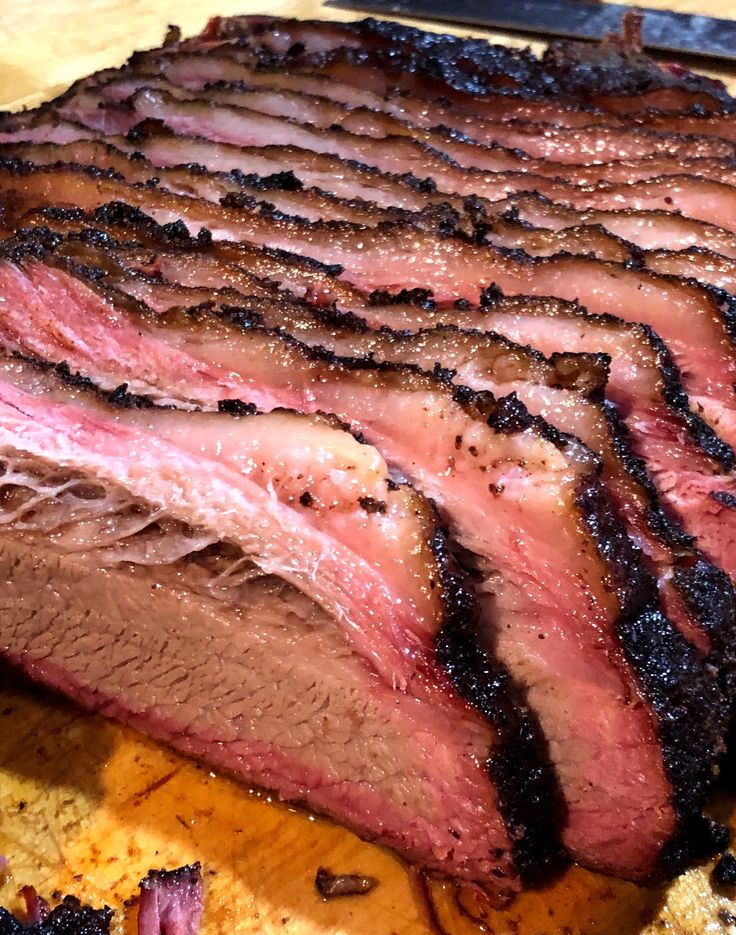 a large piece of meat sitting on top of a cutting board