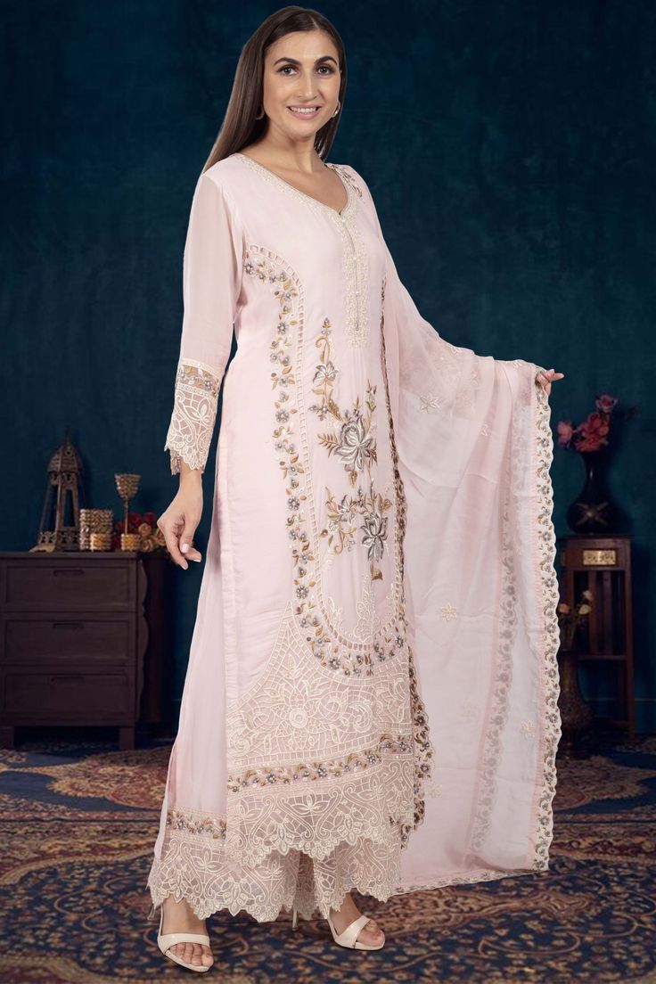 Indulge in elegance with our Partywear Suit D-241. Adorned with exquisite pearl and floral thread embroidery, this suit exudes sophistication and luxury. Elevate your style and make a statement at any special occasion with this premium piece. Designer Georgette Palazzo Set With Intricate Embroidery, Designer Party Wear Palazzo Set With Intricate Embroidery, Formal Floor-length Sets With Pearl Embroidery, Elegant Palazzo Set With Zari Work And Traditional Drape, Elegant Designer Wear Georgette Palazzo Set, Party Wear Semi-stitched Palazzo Set With Intricate Embroidery, Party Wear Palazzo Set With Intricate Embroidery, Elegant Semi-stitched Palazzo Set For Party, Elegant Palazzo Set With Pearl Embroidery For Parties