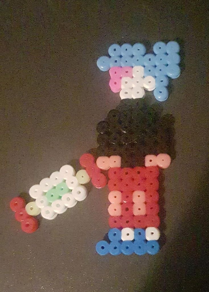 the letters are made out of plastic beads