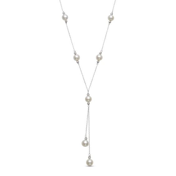 Shimmering freshwater cultured pearls are stationed along this elegant lariat necklace, with an additional pair dangling at staggered lengths from the center. Delicate textured beads bookend each pearl to complete the look. Crafted in sterling silver, the 18-inch cable chain secures with a spring ring clasp. Formal Pearl Lariat Necklace, Formal Dangle Lariat Necklace With Pearl Drop, Classic Pearl Chain Lariat Necklace For Formal Occasions, Formal Adjustable Lariat Necklace With Pearl Drop, Formal Dangle Pearl Drop Lariat Necklace, Classic Formal Lariat Necklace With Pearl Drop, Formal Adjustable Backdrop Necklace With Pearl Drop, Adjustable Formal Backdrop Necklace With Pearl Drop, Classic Lariat Pearl Necklace With Adjustable Chain