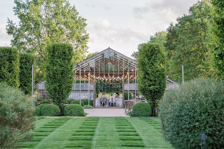 an outdoor wedding venue surrounded by greenery