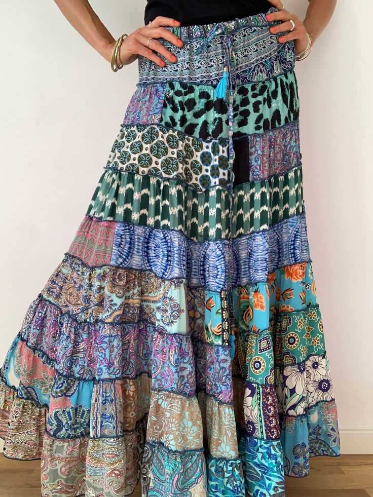 "This gorgeous colourful gypsie skirt is all fun to wear, boho style inspired long and flowy true hippy girl skirt it is free size and floor length always one of a kind  patchwork, made of varieties of different fabrics with floral patterns,  very easy to wear and comfy  it has elasticated waist band, and will fit most of sizes S-L MEASURE One Size Fits Most length 39 \"/100 cm waist 28-40\" / 66-100cm  For more boho style ideas please visit also  https://www.etsy.com/uk/shop/Gyaki CARE * Hand w Boho Print Tiered Skirt For Festival, Hippie Tiered Skirt With Boho Print, Summer Bohemian Tiered Maxi Skirt, Bohemian Tiered Maxi Skirt For Summer, Hippie Maxi Skirt With Boho Print, Multicolor Bohemian Maxi Skirt For Festivals, Bohemian Multicolor Maxi Skirt For Festivals, Multicolor Bohemian Dress With Ruffled Skirt, Bohemian Ruffled Maxi Skirt For Beach