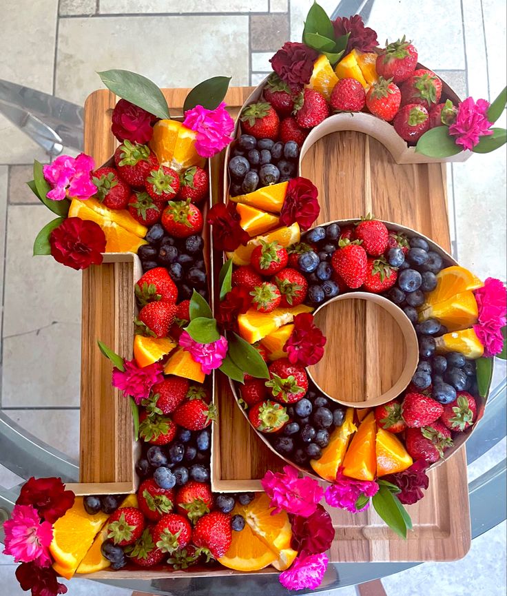 the number six is made up of fruits and flowers