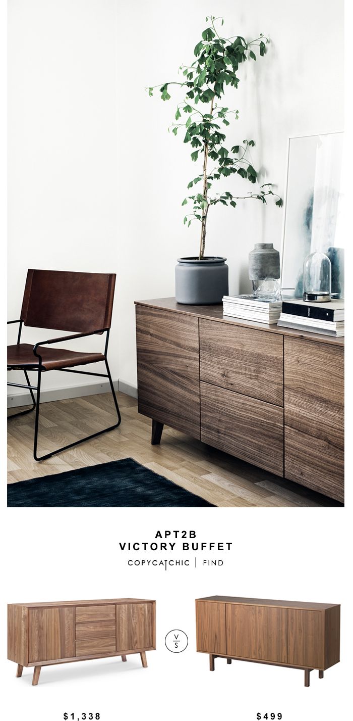 the sideboard is made from wood and has a plant in it, along with other furniture