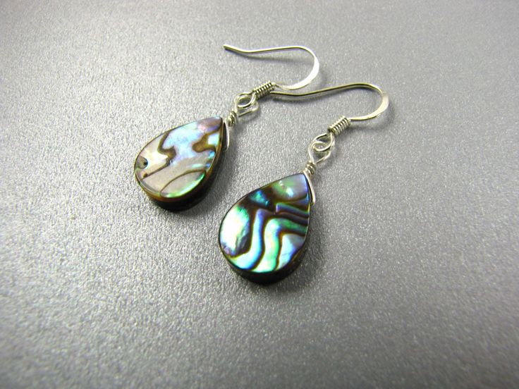 "Abalone Earrings - choice of silver plated or sterling silver at checkout This is a listing for 1 pr of earrings. I included pics of both so you can see that every pr will have its own unique pattern. Choice of silver plated or sterling silver at checkout The silver plated wires are hypoallergenic nickel and copper free. They dangle down almost 1 1/2\" from the top of the ear wire or 36 mm for my metric friends. Please see pic in hand for size reference. These come in a cute gift bag. I can mak Pierced Teardrop Pendant Jewelry For Gift, Silver Drop Pierced Earrings As Gift, Unique Pearl Drop Teardrop Earrings, Unique Silver Dangle Teardrop Earrings, Unique Teardrop Pearl Drop Earrings, Unique Silver Teardrop Dangle Earrings, Silver Adjustable Drop Earrings, Unique Sterling Silver Teardrop Earrings For Gift, Gift Pear-shaped Teardrop Earrings