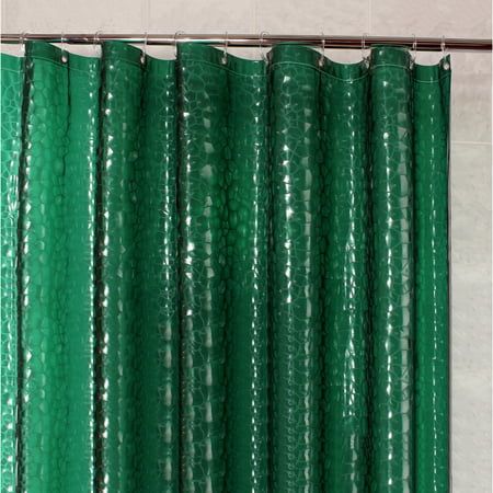 a green shower curtain hanging from a metal rod