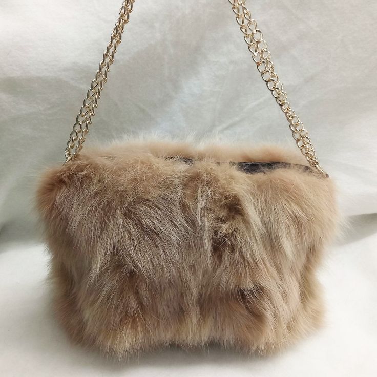 Beige Fox Top Handle *Top Handle is made from high quality, real fox fur. *Elegant, soft and modern handbag. *Combined with metal chain. *Inside has matte cotton lining. *Ιnternally divided into two spaces *Closes with a zipper on top. It Is a handmade product and all of the materials are carefully selected. During the construction process we follow a special process of professional cleaning so you can receive it in the appropriate condition that will last many years. MADE IN GREECE * For more i Luxury Faux Fur Shoulder Bag With Fur Lining, Luxury Faux Fur Shoulder Bag, Luxury Faux Fur Evening Bag, Luxury Evening Bags In Faux Fur, Elegant Evening Shoulder Bag With Faux Fur Lining, Winter Evening Bag In Faux Fur, Winter Evening Bags In Faux Fur, Winter Evening Bags With Faux Fur, Rectangular Faux Fur Evening Bag