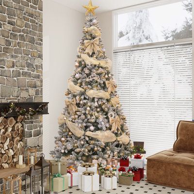 This Christmas tree is just what you need to add cheer and fuss-free upkeep to your home. This tree features lush green branches and a white snow-dusted effect that looks like freshly fallen snowflakes. Its frame keeps it standing tall, while its tree stand keeps it in place. Plus, it arrives pre-strung with clear lights that bring a bright ambiance to your living room or mudroom. Choose from an assortment of tree sizes that best suit your space. The Holiday Aisle® Size: 5' H | The Holiday Aisle Simple Christmas Tree Decor, Christmas Tree Bedding, Champagne Christmas Tree, Christmas Tree Decoration Ideas, Christmas Tree Decorations Ideas, Frosted Christmas Tree, Spruce Christmas Tree, Fir Christmas Tree, Tree Themes